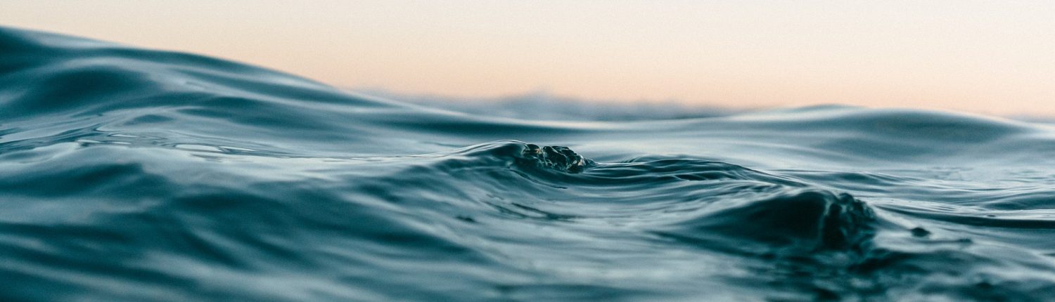 Ocean surface with morning yellow sky