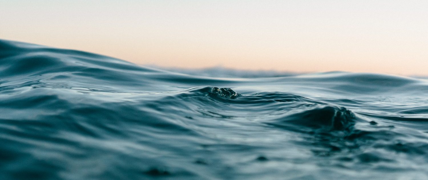 Ocean surface with morning yellow sky