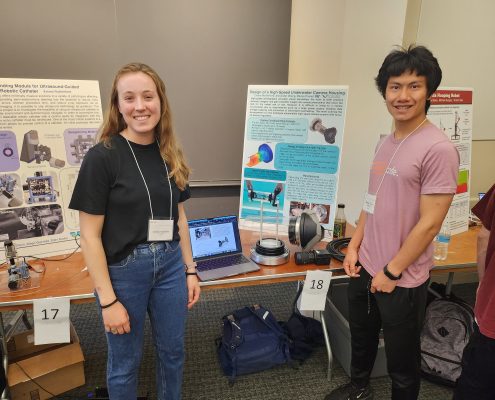 MIT MechE/MIT Sea Grant students Emma Rutherford and Alexander Zhang with their poster and housing design for a high-speed underwater camera.