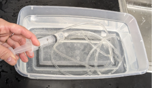 Filling syringe and tubing with water