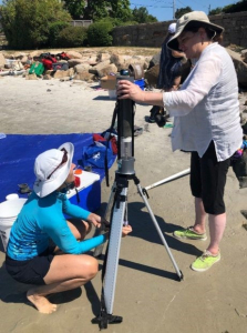 Dr. Heidi Nepf of the MIT Department of Civil and Environmental Engineering and Dr. Julie Simpson of MIT Sea Grant working on extruding and slicing a sediment core at the field site. Photo credit: Heidi Nepf.